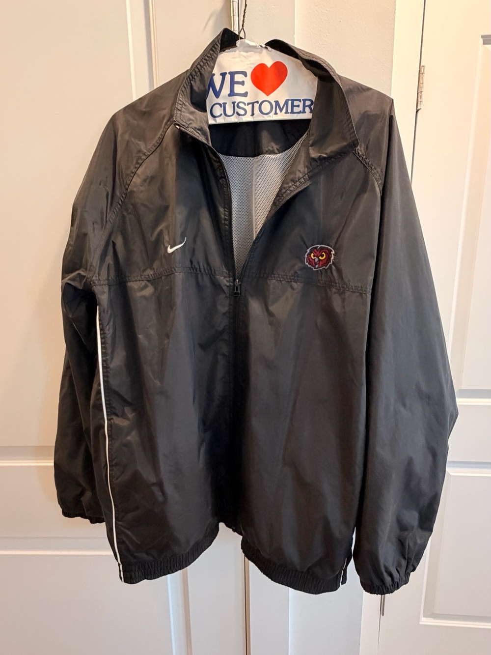 Nike Black Windbreaker Jacket with Red and Gold Patch